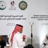 A reporter for Sky News Arabia television channel speaks before the camera from the media centre set up for the 2025 ArabIslamic extraordinary summit in Doha on September 15, 2025.