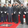Gary Sinise receives a star on the Hollywood Walk of Fame, surrounded by armed guard, 2017.