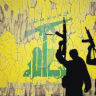 Hezbollah flag mural provides backdrop for gun-wielding shadows.
