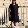 Rabbi Robin Fryer Bodzin stands in front of the Western Wall in Jerusalem. 