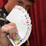 Creative director/magician Douglas "Lefty" Leferovich fans out a deck of cards before teaching magic tricks on Facebook Live with magician/comedian Murray SawChuck from SawChuck's home to entertain people under stay-at-home orders to fight the spread of the coronavirus on April 25, 2020 in Las Vegas