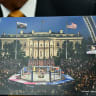 US President Donald Trump shows a rendering of the upcoming "UFC Freedom 250" event as he speaks in the Oval Office of the White House on May 6, 2026, in Washington, DC. An Ultimate Fighting Championship event will be staged on the White House's South Lawn in June. The June 14 event has been dubbed 