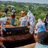 Red Cross workers prepare to lower the coffin of Dr Tibenderana Katho Blaise who worked at the Centre Medical Evangelique (CME) in Hoho commune and died of Ebola virus, at the Nyamurongo cemetery in Bunia town, Ituri province, Democratic Republic of Congo, May 26, 2026. 