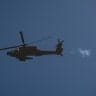 An Israeli military helicopter is seen flying above the Israel-Lebanon border during an Israeli military operation, June 4, 2026.