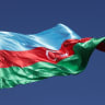 The Azerbaijani flag flies in the city center one day before the opening of the UNFCCC COP29 Climate Conference on November 10, 2024 in Baku, Azerbaijan.