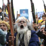 Supporters of the Iran-backed Houthi movement brandish their weapons as they rally in solidarity with Iran and Lebanon amid the Middle East war, in the capital Sanaa on April 17, 2026. 