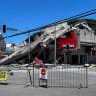 A road is blocked near the collapsed building after a magnitude 7.8 quake in General Santos, Philippines, June 8, 2026. Picture taken with a mobile phone.