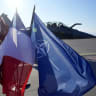  Latvian, French and NATO flags flutter in front of a French Rafale fighter jet of the NATO Baltic Air Policing mission, in the Lielvarde air base, Latvia April 14, 2026.