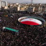 Large crowds gather during a joint funeral held for Ali Larijani, Secretary of Iran's Supreme National Security Council, Basij commander Major General Gholam Soleimani, and 84 sailors from the Iranian Navy frigate IRIS Dena, on March 18, 2026 in Tehran, Iran.