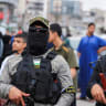 Terrorists from Palestinian Islamic Jihad's al-Quds Brigades stand guard on the street during an Eid al-Adha celebration in Gaza City, May 27, 2026; illustrative.
