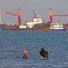 In this picture obtained from Iran's ISNA news agency on June 1, 2026, Iranians swim at Suru Beach in Bandar Abbas along the Strait of Hormuz. 