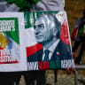  A man holds a picture of Iran's Crown Prince Reza Pahlavi as demonstrators protest outside the Iranian embassy in Lisbon, Portugal, April 25, 2026.