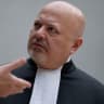 Chief Prosecutor Karim Khan talks while waiting for former Philippine President Rodrigo Duterte to appear via video link before the International Criminal Court (ICC), in The Hague, Netherlands, Friday, March 14, 2025.