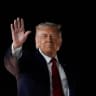 US President Donald Trump gestures as he boards Air Force One, after attending Game 3 of the NBA Finals, at John F. Kennedy International Airport in New York, June 8, 2026.