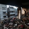 Palestinians inspect damage after alleged Israeli air strikes on apartment buildings on June 4, 2026 in Gaza City, Gaza. 