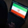 An illustrative photo of a laptop displaying the Iranian flag, representing Iran in a digital or cyber context, March 27, 2026. 