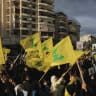 People hold Hezbollah flags while commemorating Israel’s withdrawal from southern Lebanon in 2000, in the southern suburbs of Beirut, Lebanon, May 25, 2026.