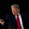 US President Donald Trump reacts as he boards Air Force One, after attending Game 3 of the NBA Finals, at John F. Kennedy International Airport in New York.