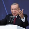 Turkish President Tayyip Erdogan speaks during a ceremony for the handover of new vehicles to the gendarmerie and police forces in Istanbul, Turkey, November 28, 2025.