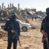 Hamas terrorists as Egyptian workers accompanied by members of the ICRC search for the last two remaining bodies of hostages -an Israeli soldier and a Thai national- from under the rubble of the Jabalia refugee camp, in the Gaza Strip on December 1, 2025; Illustrative.