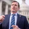 Rep. Dan Goldman talks with a reporter outside the US Capitol on December 18, 2025.