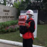 A PROTESTER holds a sign during a demonstration against the military coup outside the US Embassy in Yangon on February 21, 2021.