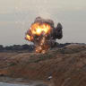 A MANPADS (Man-Portable Air Defiance Systems) missile is detonated along the shore facing the Firing Range, east of the Libyan capital Tripoli, on December 11, 2011. A top U.S. official said that a team of U.S. and Libyan bomb-disposal specialists has secured about 5,000 surface-to-air missiles. 