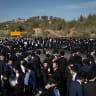 Ultra orthoodx jewish men block a road and clash with police during a protest against the jailing of yeshiva students who failed to comply with an army recruitment order, in Jerusalem, June 11, 2026. 