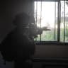 AN IDF soldier aiming out of a window in southern Lebanon.
