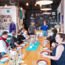 Participants in the Miszpucha Foundation trip for Polish Jewish emigrants and their descendants have lunch at the Jewish Community Center in Warsaw, Poland.