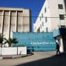A PALESTINIAN man walks past the building of the UNRWA headquarters in Gaza City on January 8, 2018.