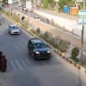 Afghan women walk across a street in Herat on June 8, 2026. 