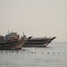 Vessels are anchored in the Strait of Hormuz, as seen from Musandam, Oman, June 10, 2026.