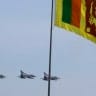 Sri Lanka air force IAI Kfir fighter jets fly past a national flag during the National Victory Ceremony in Colombo June 3, 2009. 