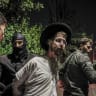 Ultra-Orthodox Jewish men protest outside the home of Military Police commander Brig.-Gen. Yuval Yamin, in Ashkelon, April 28, 2026