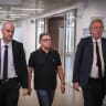 Prof. Menachem Elkalay (C), accused of committing a series of serious sexual offenses during medical treatments he allegedly provided as a gynecologist, arrives for a court hearing at the Tel Aviv District Court, June 16, 2026.