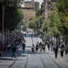 People walk on Jaffa Street in central Jerusalem, June 15, 2026.