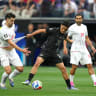 Inglewood, California, USA; New Zealand forward Elijah Just (11) and Iran forward Mohammad Mohebi (8) battle for the ball in the first half during a Group G match in the 2026 FIFA World Cup at Los Angeles Stadium, June 15, 2026.