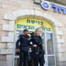 POLICE OUTSIDE the Zol Bagadol supermarket in Jerusalem.
