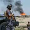Gas flares burn at the Rumaila oil field during an armed patrol by Iraqi Energy Police in Basra, Iraq, June 8, 2026.