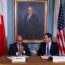 US Secretary of State Marco Rubio and Bahrain's Foreign Minister Abdullatif bin Rashid Al Zayani react during a Nuclear Cooperation Memorandum of Understanding (MOU) signing ceremony, at the US Department of State in Washington, DC, US, July 16, 2025. 