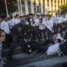 Ultra-Orthodox Jews block a road and clash with police during a protest against the jailing of yeshiva students who failed to comply with an army recruitment order, at Mount Herzl in Jerusalem, June 18, 2026
