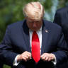 US PRESIDENT Donald Trump checks his tie at the G7 summit.