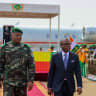 The head of the Nigerien junta, General Abdourahamane Tiani, walks with Beninese President Romuald Wadagni during his arrival for the first leg of a visit to Niger and Burkina Faso, at the Diori Hamani International Airport in Niamey, Niger June 2, 2026.