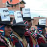 Members of the "Ponchos Rojos" community wearing signs reading "Union Police" on their hats attend a meeting to discuss the future of protests ongoing for more than six weeks in Tilata, La Paz department, Bolivia, on June 18, 2026.