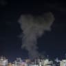 SMOKE RISES after an Israeli airstrike on a house in Al-Shati refugee camp west of Gaza City on May 8, 2026.