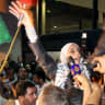 Ahlam Tamimi waves as she arrives at Queen Alia international airport in Amman, late October 18, 2011.