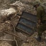 An Israeli soldier inspects a Hezbollah attacking position tunnel found during anIDF operation.