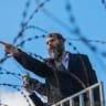 Motti Babchik and thousands of Ultra-Orthodox Jewish men protest outside Military Prison 10 near Kfar Yona, central Israel, against the jailing of seminary students who failed to comply with an army recruitment order, June 17, 2026.