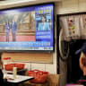A TELEVISION shows the meeting between Kuomintang (KMT) chairwoman Cheng Li-wun and Chinese President Xi Jinping in Beijing, at a restaurant in Taipei, in April 2026.